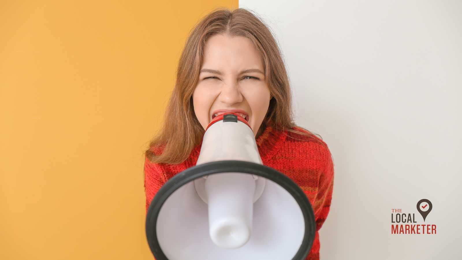 Photo of a woman screaming into a megaphone